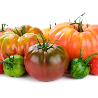 Delicious and beautiful organic heirloom tomatoes.  Shallow dof.